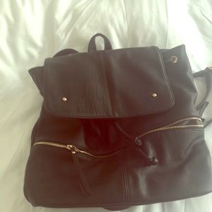 Like new, faux leather backpack, gold hardware